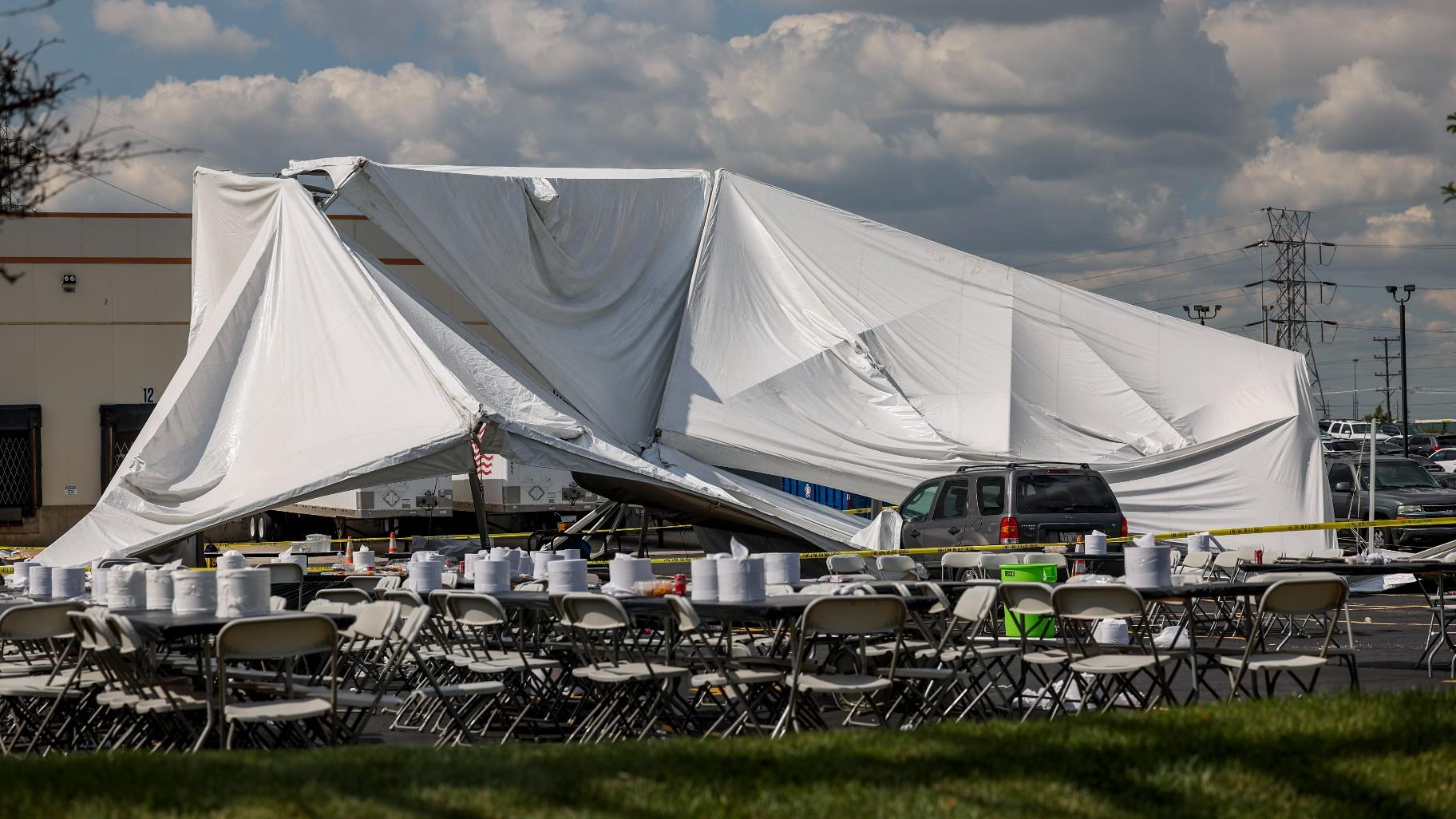 A collapsed tent sits in a parking lot in the 5600 block of West 73rd Street Thursday, Sept. 14, 2023 in Bedford Park, Chicago. Police say a number of people were injured. (Armando L. Sanchez / Chicago Tribune via AP)