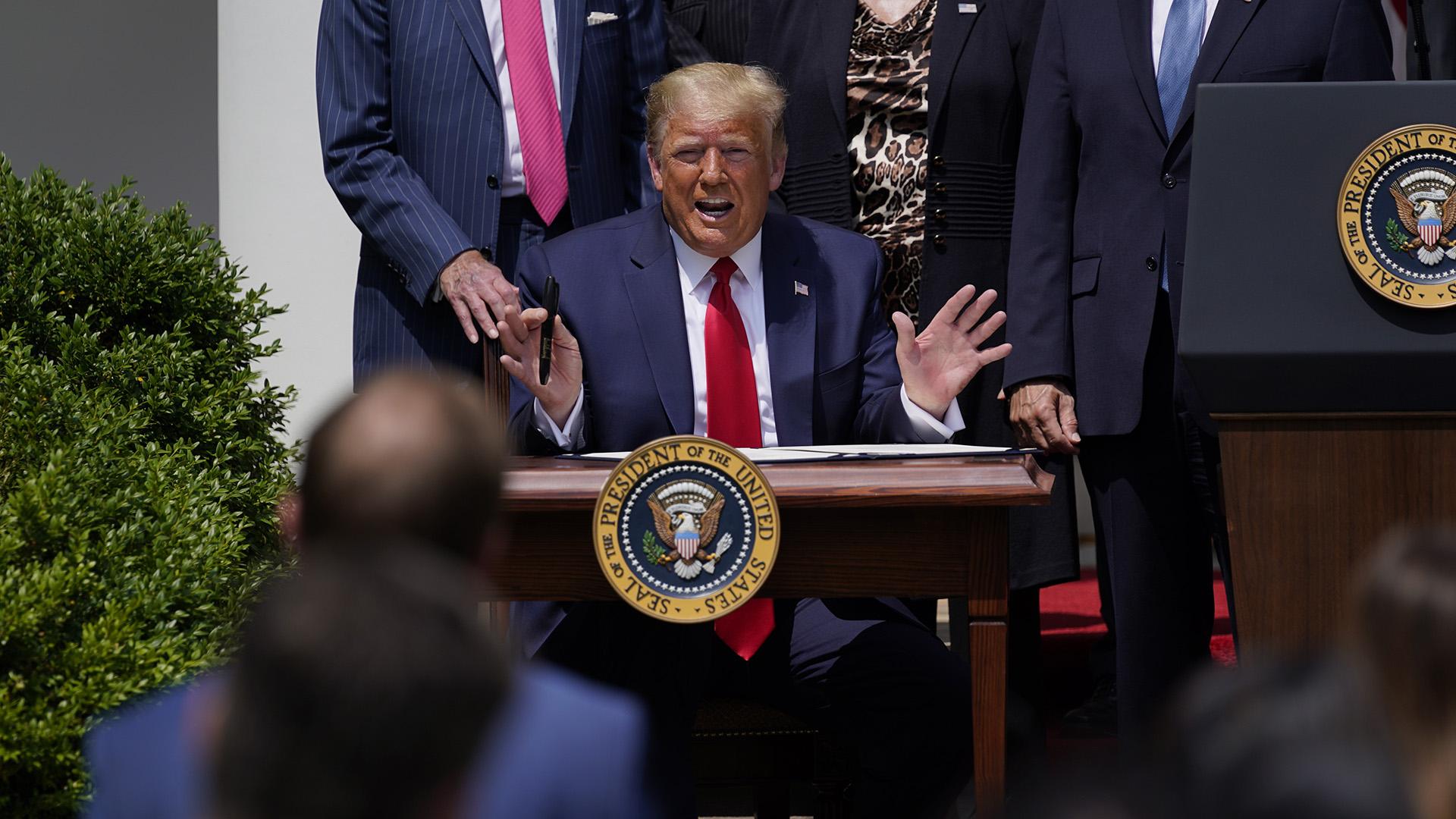 President Donald Trump speaks as he signs the Paycheck Protection Program Flexibility Act during a news conference in the Rose Garden of the White House, Friday, June 5, 2020, in Washington. (AP Photo / Evan Vucci)