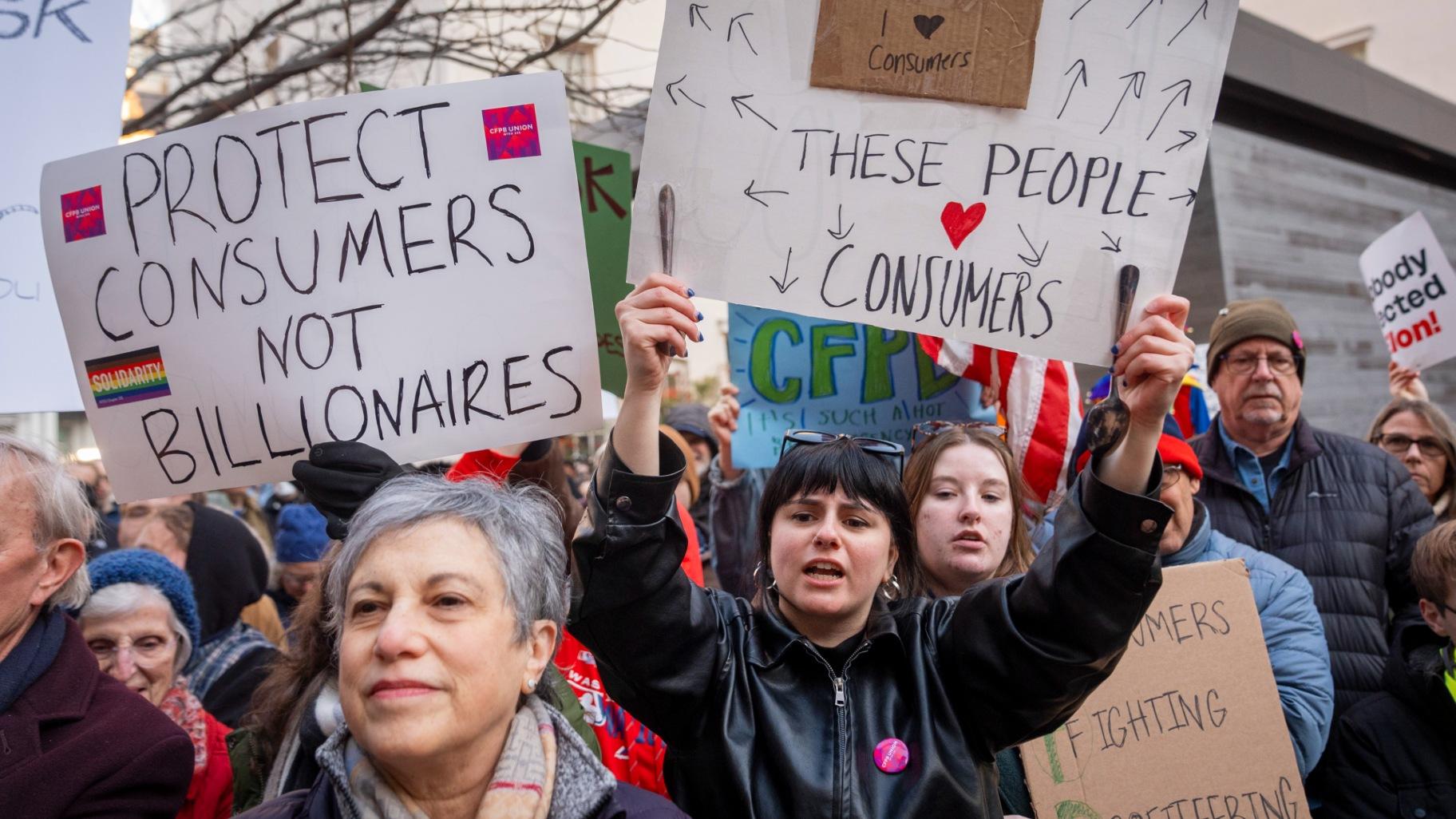 People attend a protest in support of the Consumer Financial Protection Bureau (CFPB) headquarters, Monday, Feb. 10, 2025, at the CFPB in Washington. (Jacquelyn Martin / AP Photo) People attend a protest in support of the Consumer Financial Protection Bureau (CFPB) headquarters, Monday, Feb. 10, 2025, at the CFPB in Washington. (Jacquelyn Martin / AP Photo)