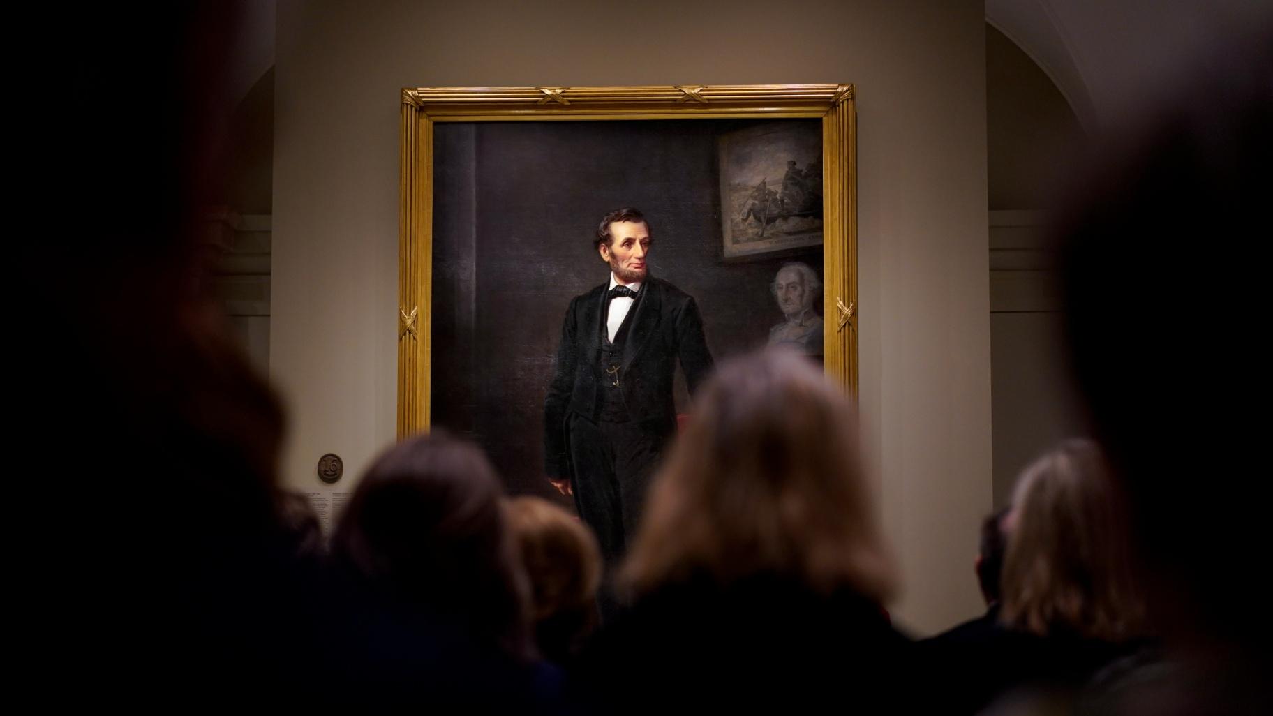 People gather for a ribbon cutting ceremony at the Smithsonian's National Portrait Gallery to announce the installation of a life-size painting of President Abraham Lincoln by artist W.F.K. Travers, Feb. 10, 2023, in Washington. (AP Photo / Carolyn Kaster, File) People gather for a ribbon cutting ceremony at the Smithsonian's National Portrait Gallery to announce the installation of a life-size painting of President Abraham Lincoln by artist W.F.K. Travers, Feb. 10, 2023, in Washington. (AP Photo / Carolyn Kaster, File)