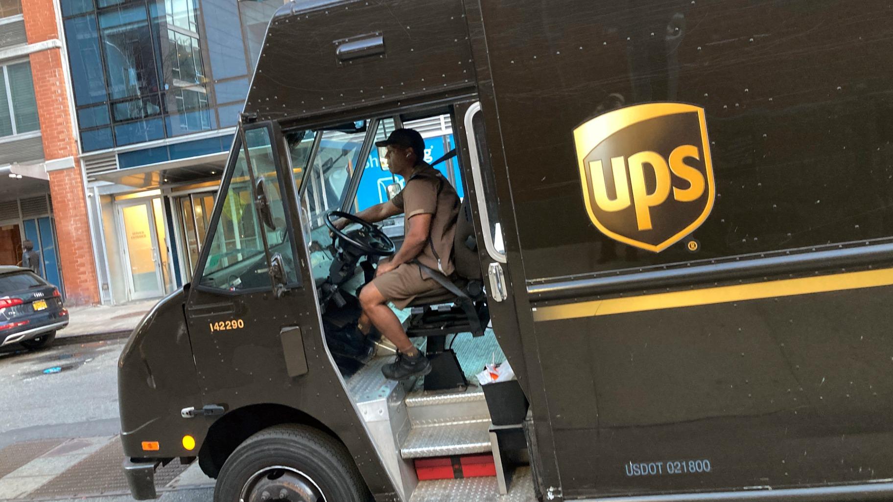 A United Parcel Service driver pilots his truck, in New York, Thursday, May 11, 2023. (AP Photo / Richard Drew)