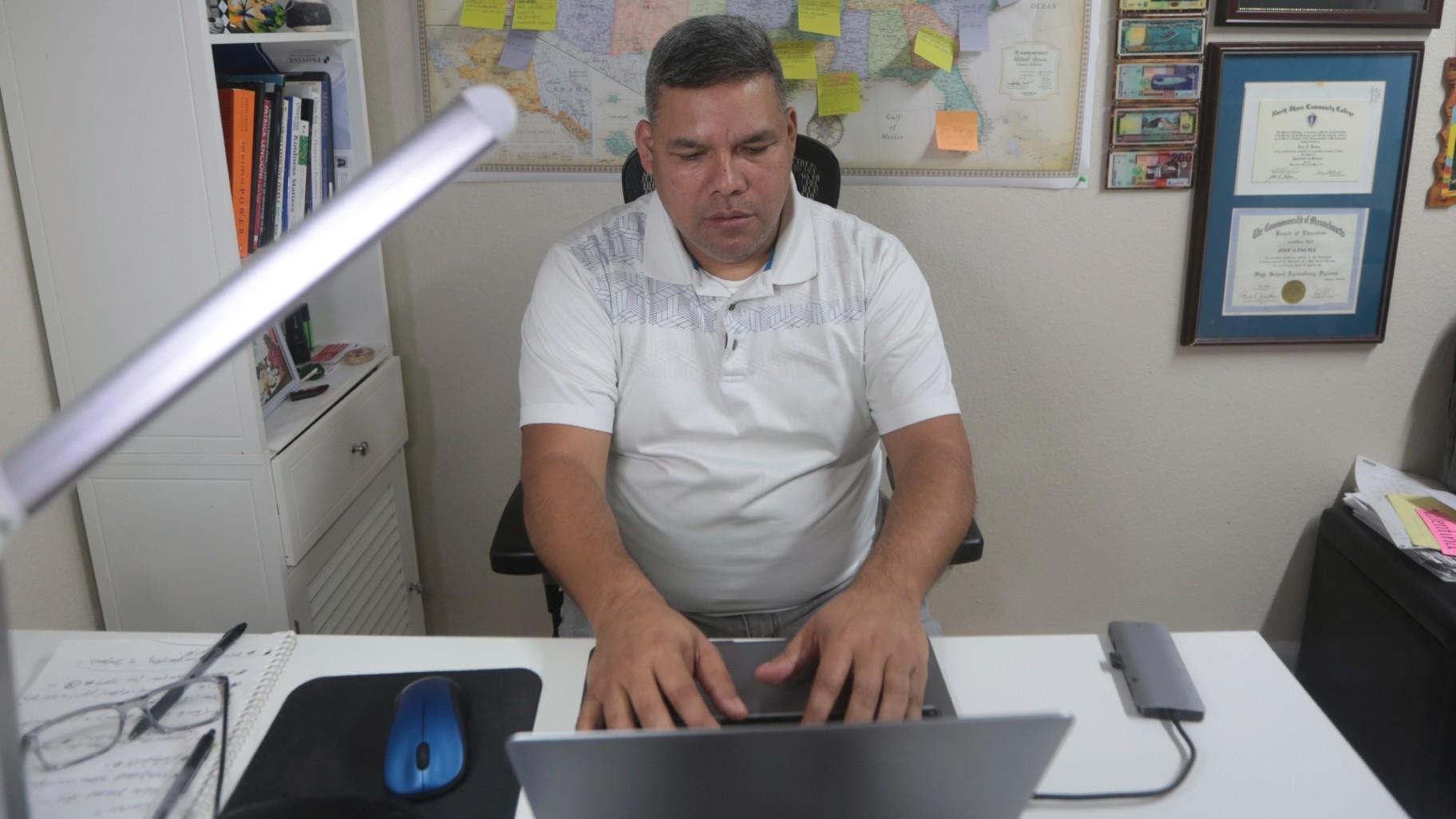 José Palma, a 48 year-old Salvadoran who has lived in the U.S. since 1998, works in home in Texas on Wednesday, Jan. 8, 2025. (AP Photo / Lekan Oyekanmi)