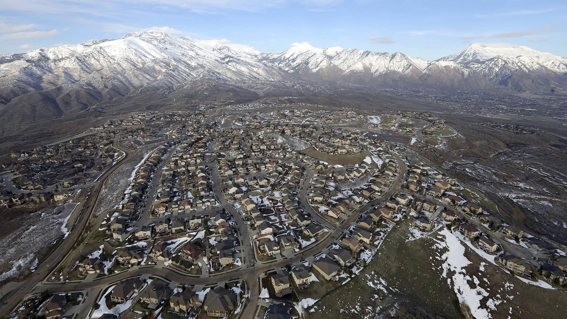 FILE - Rows of homes, in suburban Salt Lake City, on April 13, 2019. Utah is one of two Western states known for rugged landscapes and wide-open spaces that are bucking the trend of sluggish U.S. population growth. (AP Photo / Rick Bowmer, File)