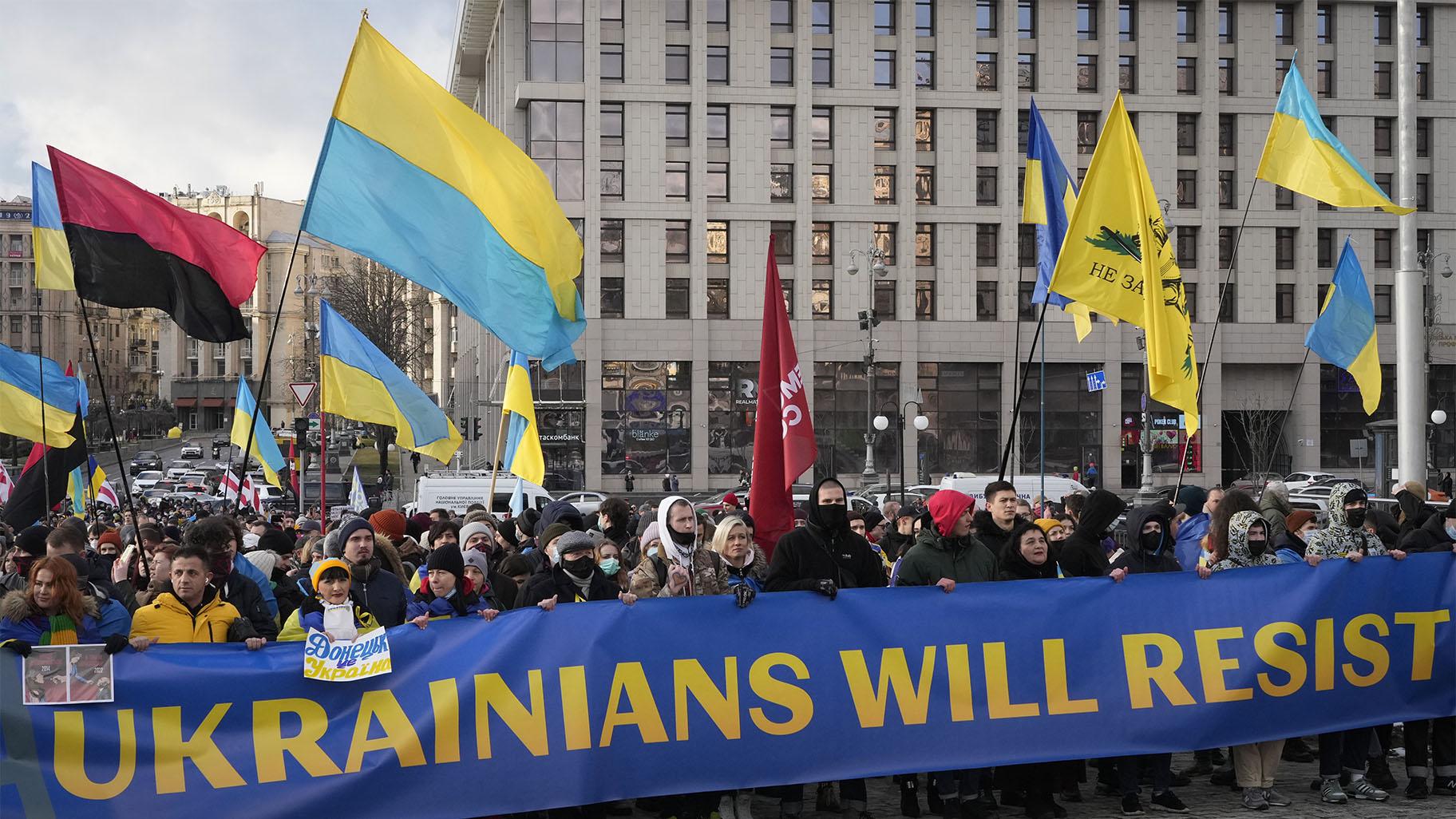 Ukrainians attend a rally in central Kyiv, Ukraine, Saturday, Feb. 12, 2022, during a protest against the potential escalation of the tension between Russia and Ukraine. (AP Photo / Efrem Lukatsky)