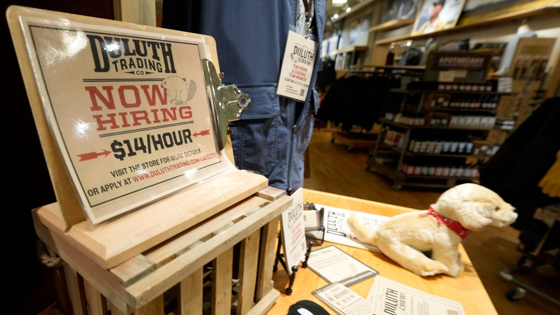 A now hiring sign sits on a display in a clothing store Saturday, Oct. 9, 2021, in Sioux Falls, S.D. (AP Photo /vDavid Zalubowski)