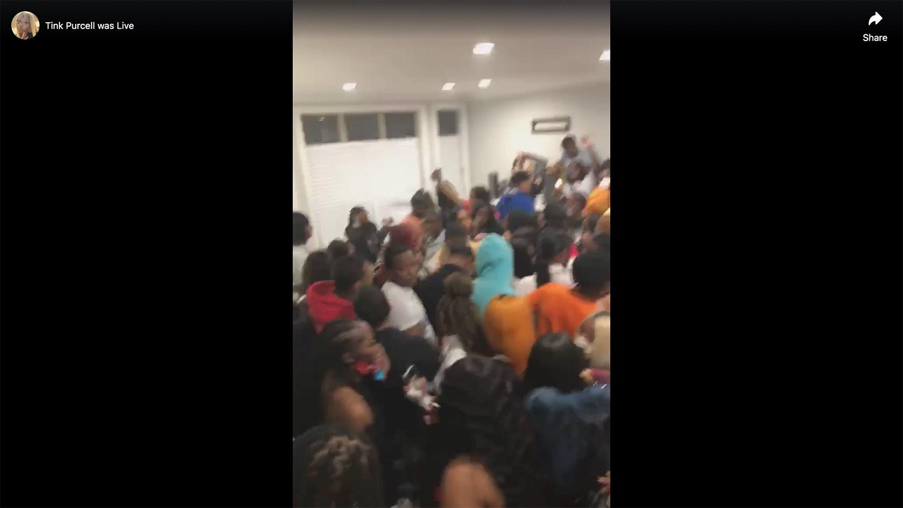 A screenshot taken from a Facebook Live video shows a crowded house party that appears to have been held in Chicago on Saturday, April 25, 2020.