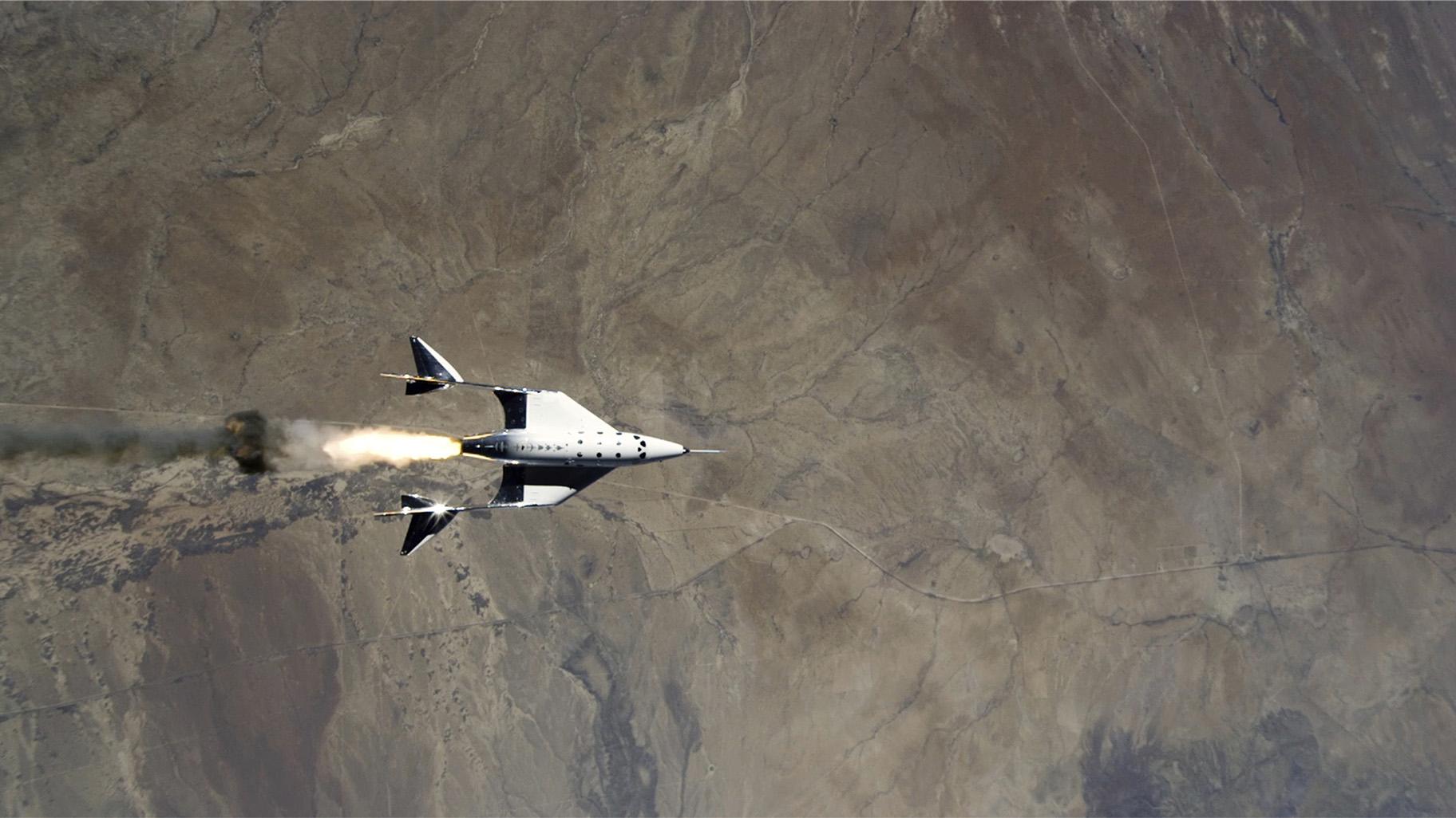 This Saturday, May 22, 2021 image provided by Virgin Galactic shows the release of VSS Unity from VMS Eve and ignition of rocket motor over Spaceport America, N.M. (Virgin Galactic via AP) 