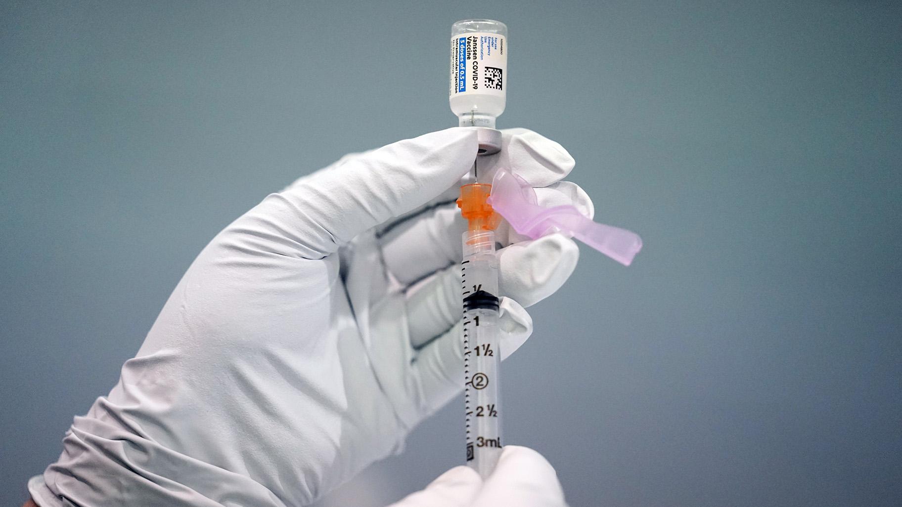 In this March 26, 2021, file photo a member of the Philadelphia Fire Department prepares a dose of the Johnson & Johnson COVID-19 vaccine at a vaccination site setup in Philadelphia. (AP Photo / Matt Rourke, File)