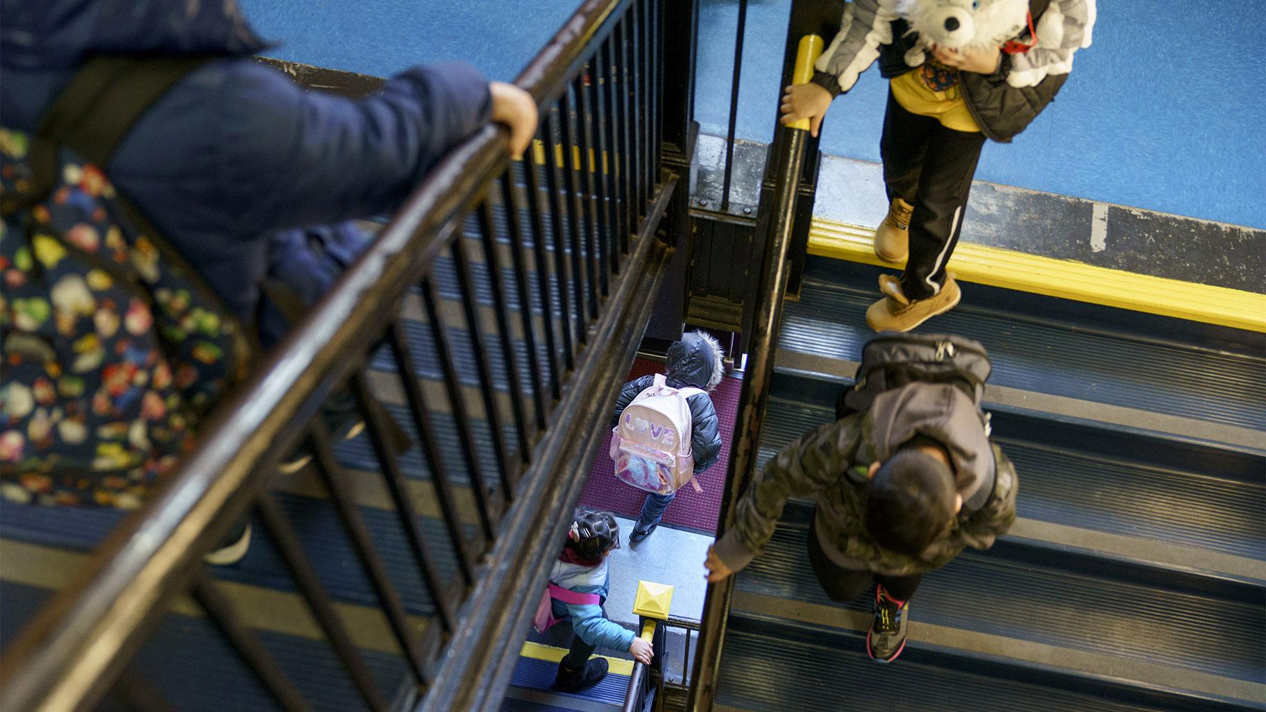 Students exit through a stairwell during dismissal at Raices Dual Language Academy, a public school in Central Falls, R.I., Feb. 9, 2022. (AP Photo / David Goldman, File)