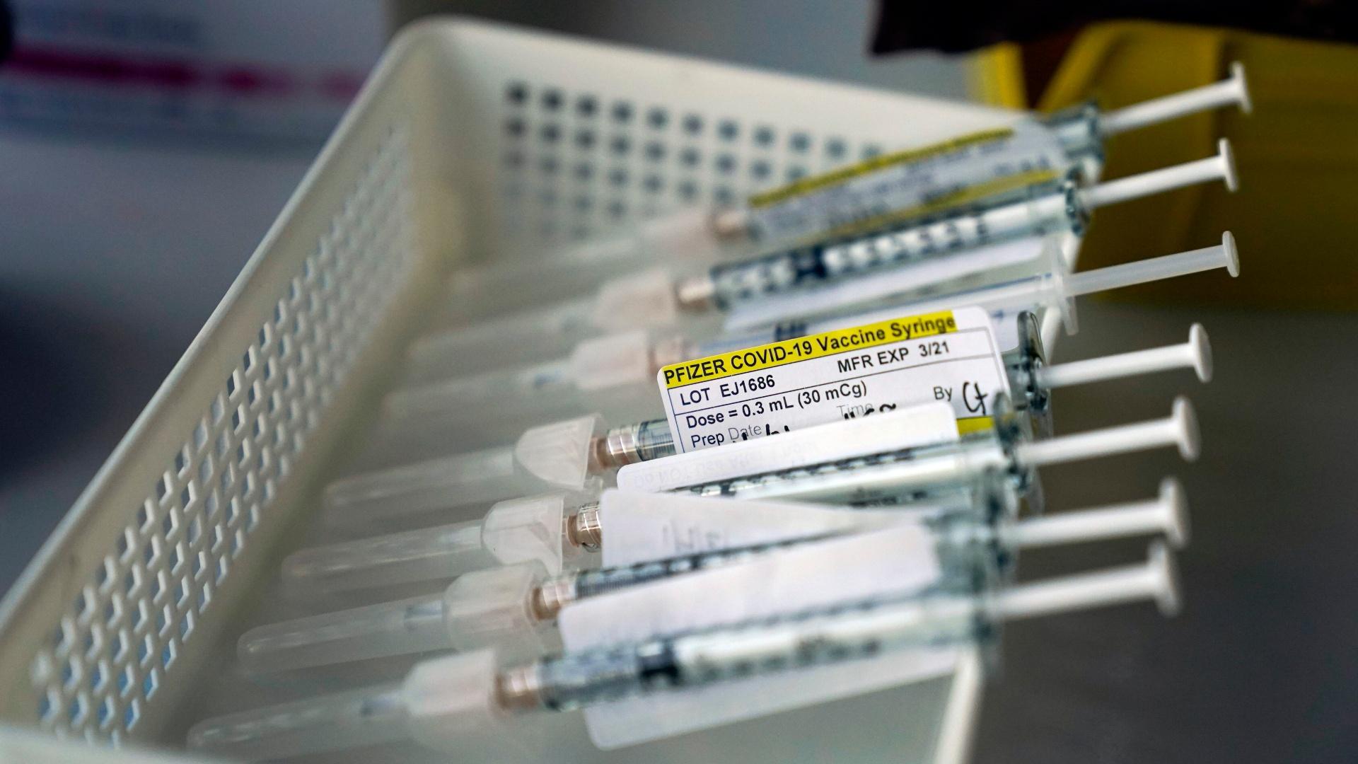 In this Jan. 7, 2021, file photo syringes containing the Pfizer-BioNTech COVID-19 vaccine sit in a tray in a vaccination room at St. Joseph Hospital in Orange, Calif. (AP Photo/Jae C. Hong, File)