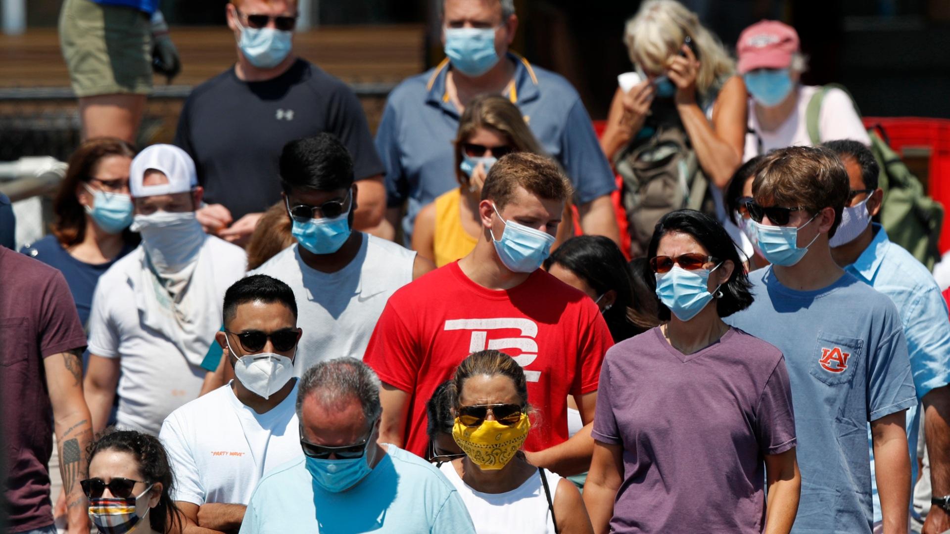 Passengers boards a Casco Bay Lines ferry bound for Peaks Island, Thursday, July 30, 2020, in Portland, Maine. State officials reported more cases of COVID-19. (AP Photo / Robert F. Bukaty)