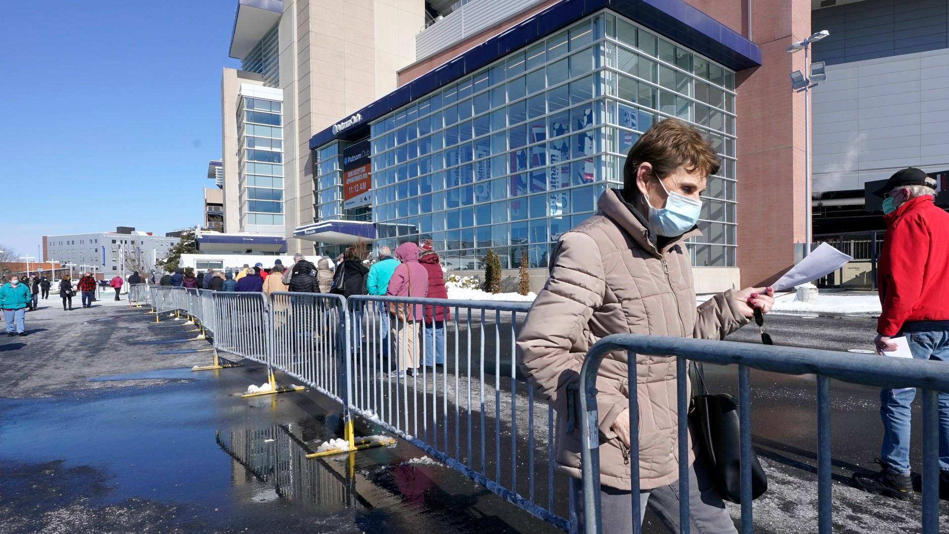 People enter a socially distanced line to get their COVID-19 vaccinations at Gillette Stadium, Monday, Feb. 8, 2021, in Foxborough, Mass. (AP Photo / Steven Senne)