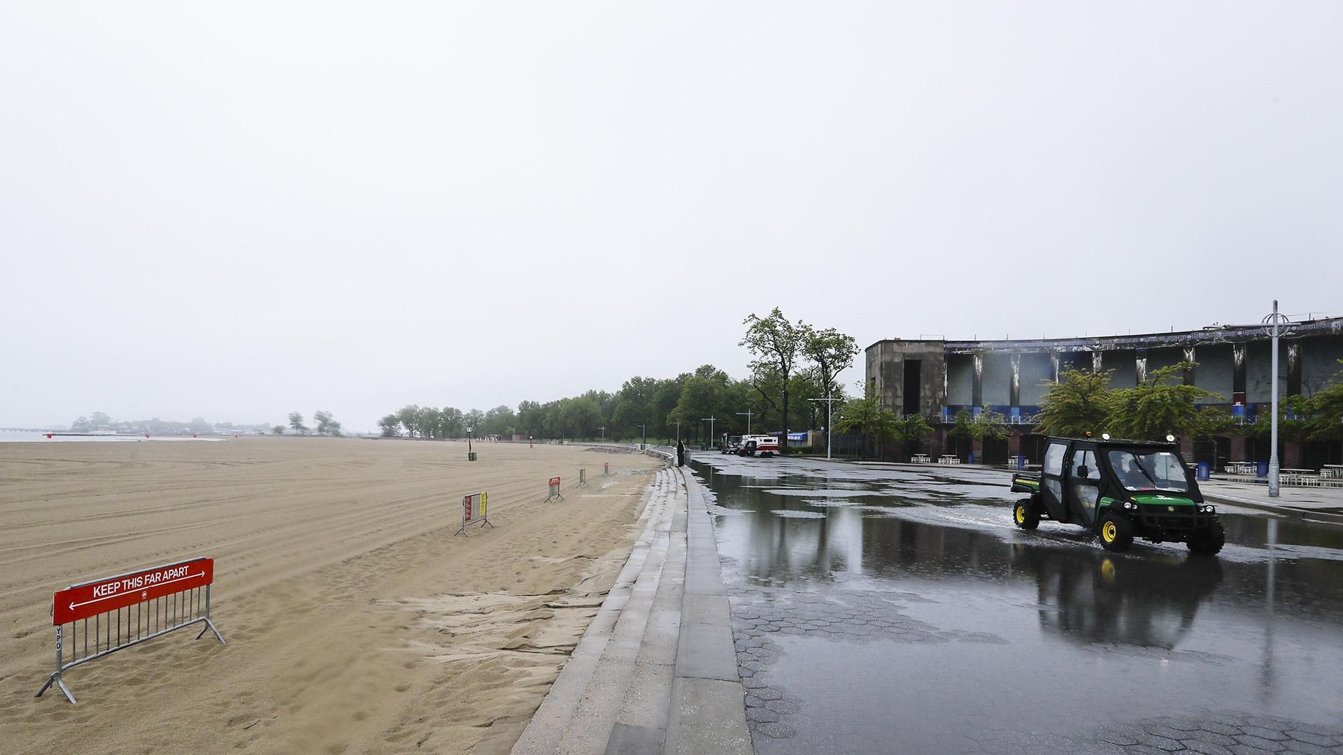 New York City Parks officials work at an empty Orchard Beach Saturday, May 23, 2020, in the Bronx borough of New York. (AP Photo / Frank Franklin II)