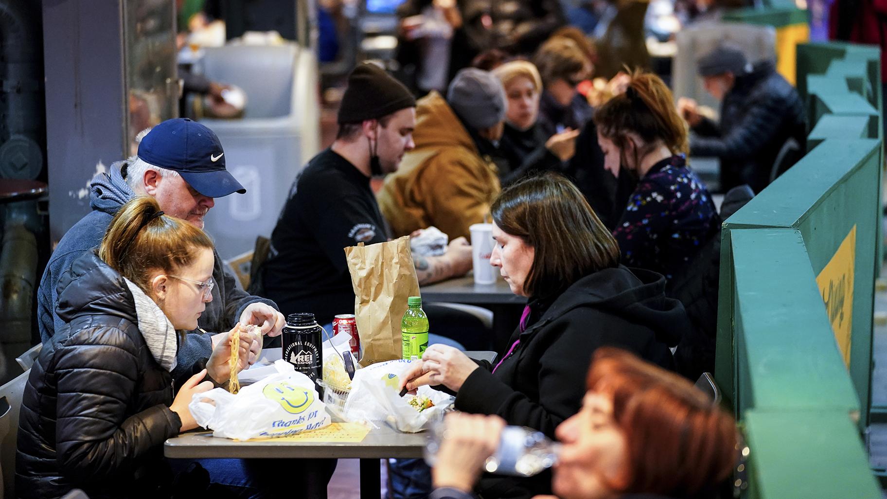 Customers eat at the Reading Terminal Market in Philadelphia, Wednesday, Feb. 16, 2022. (AP Photo / Matt Rourke)