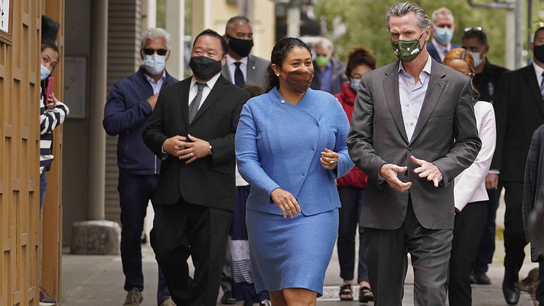 FILE - In this June 3, 2021 file photo California Gov. Gavin Newsom walks with San Francisco Mayor London Breed on Geary Street to a news conference outside Tommy's Mexican Restaurant in San Francisco. (AP Photo / Eric Risberg,File)