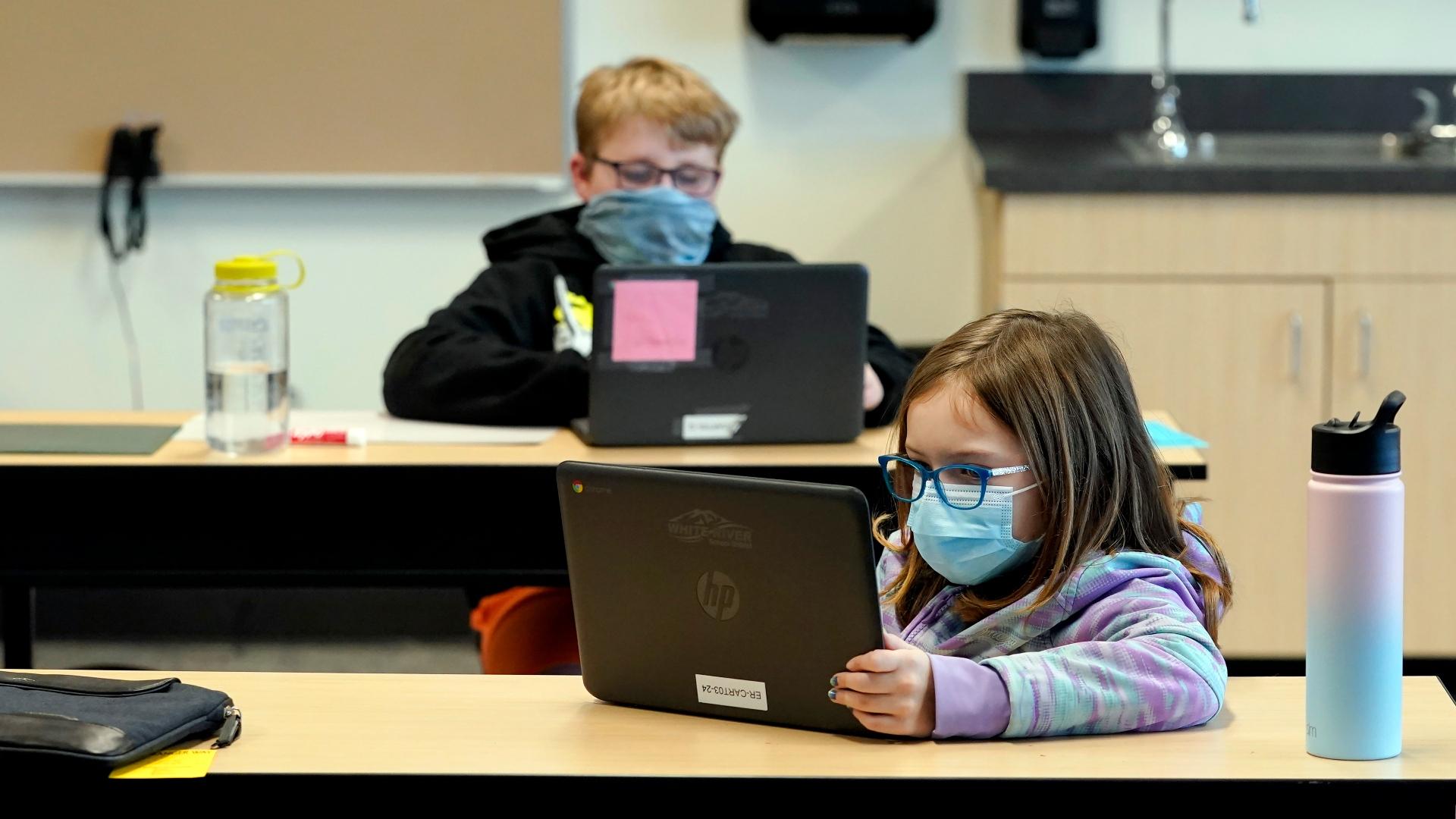 In this Feb. 2, 2021, file photo, students wear masks as they work in a fourth-grade classroom, at Elk Ridge Elementary School in Buckley, Wash. (AP Photo / Ted S. Warren, File)