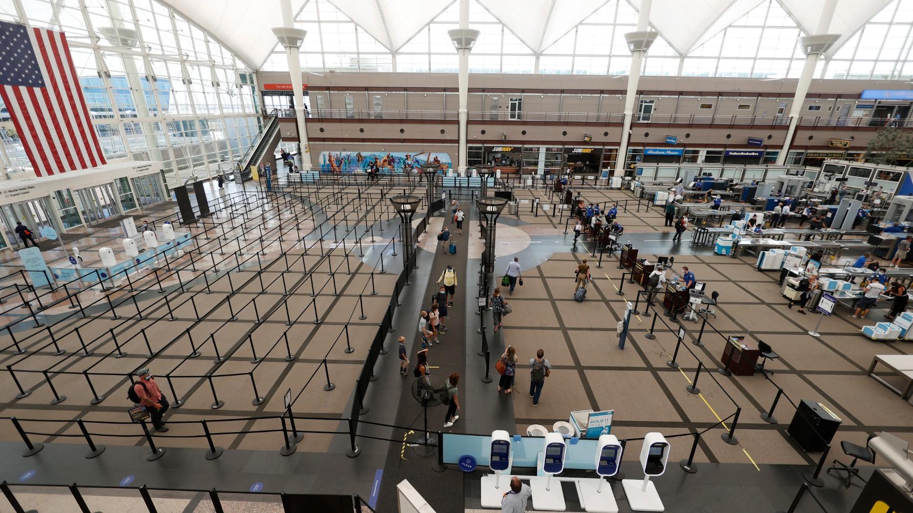 Travelers make their ways to the south security checkpoint in the main terminal of Denver International Airport Wednesday, July 22, 2020, in Denver. (AP Photo / David Zalubowski, File)