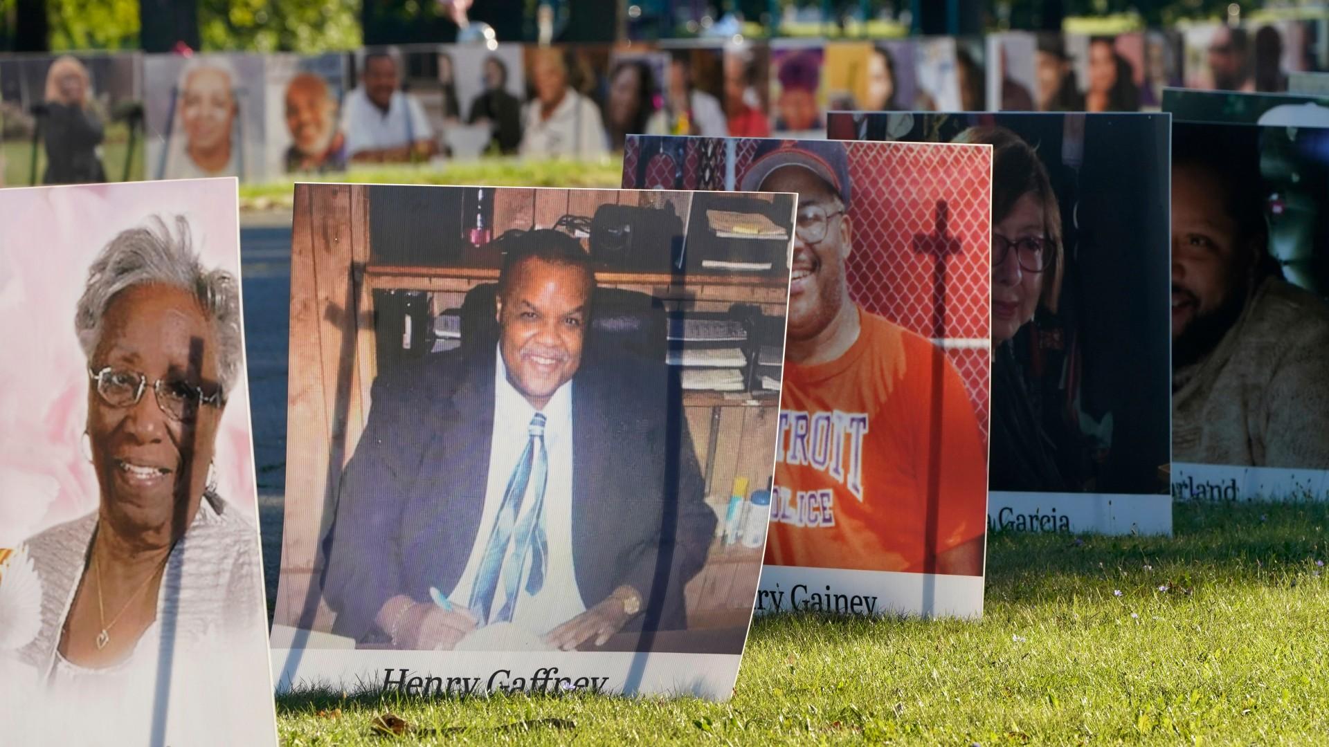 In this Monday, Aug. 31, 2020 file photo, some of the nearly 900 large poster-sized photos of Detroit victims of COVID-19 are displayed on Belle Isle in Detroit. (AP Photo / Carlos Osorio)
