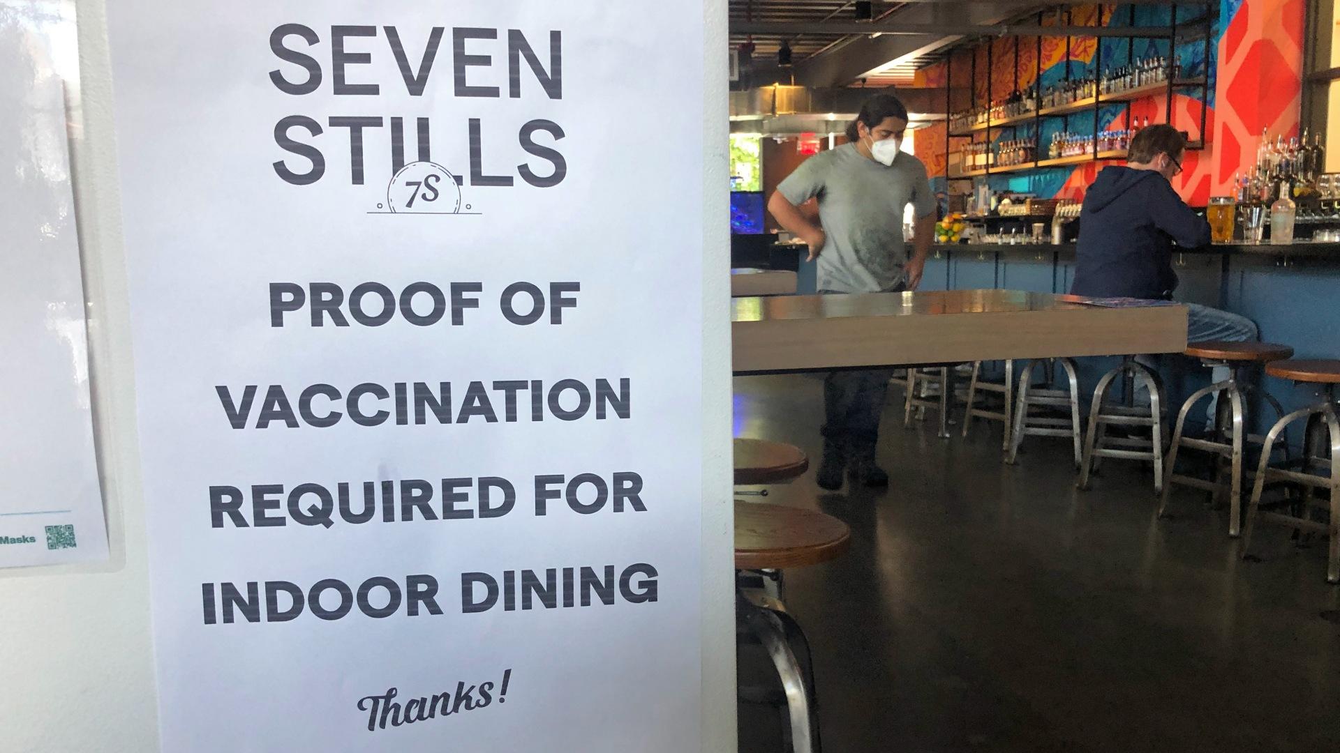 A proof of vaccination sign is posted at a bar in San Francisco on Thursday, July 29, 2021. (AP Photo / Haven Daley)