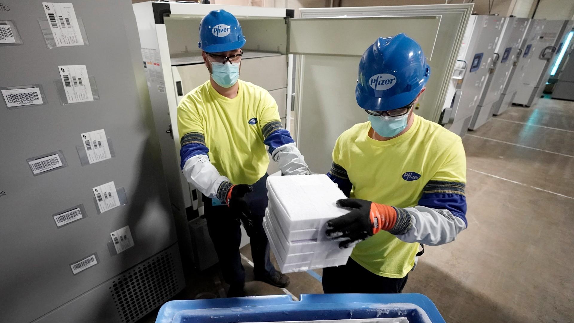 Boxes containing the Pfizer COVID-19 vaccine are prepared to be shipped at the Pfizer Global Supply Kalamazoo manufacturing plant in Portage, Mich., Dec. 13, 2020. (AP Photo / Morry Gash, Pool, File)