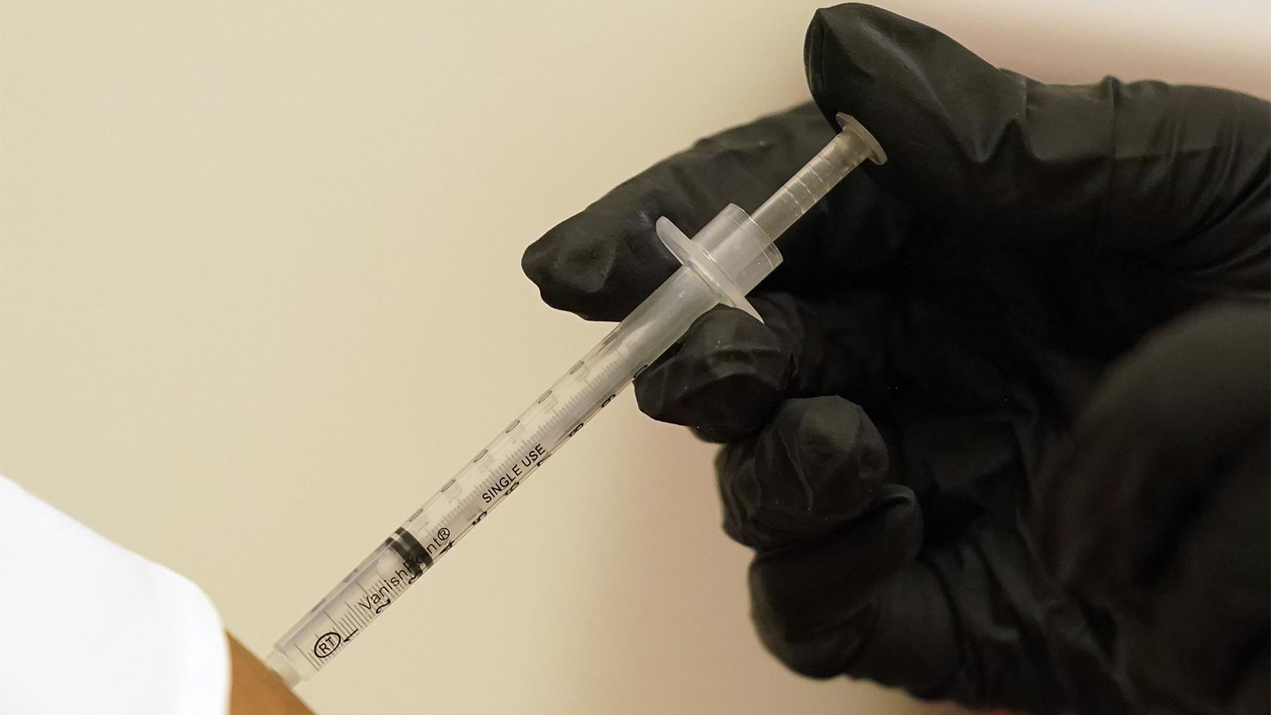 A person is injected with her second dose of the Pfizer COVID-19 vaccine at a Dallas County Health and Human Services vaccination site in Dallas, Thursday, Aug. 26, 2021. (AP Photo / LM Otero, File)