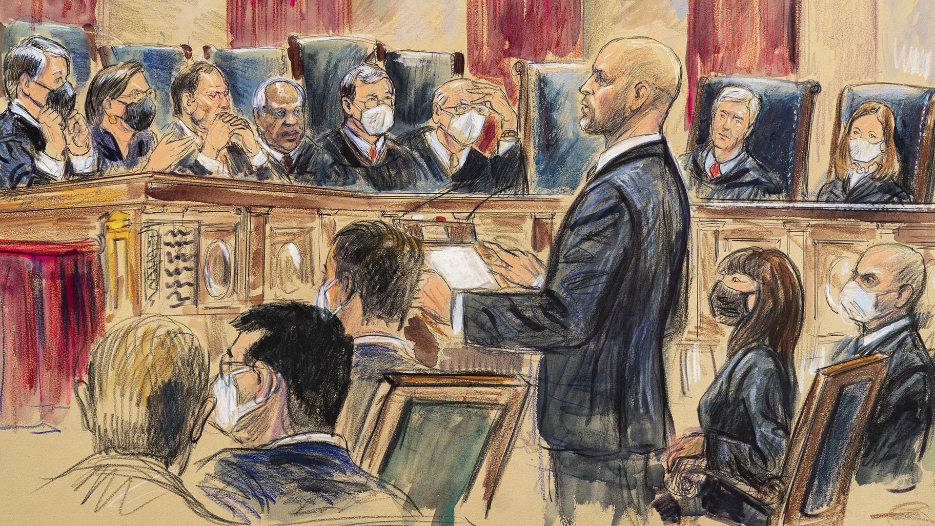 This artist sketch depicts lawyer Scott Keller standing to argue on behalf of more than two dozen business groups seeking an immediate order from the Supreme Court to halt a Biden administration order to impose a vaccine-or-testing requirement on the nation's large employers during the COVID-19 pandemic, at the Supreme Court in Washington, Jan. 7, 2022. (Dana Verkouteren via AP, File)