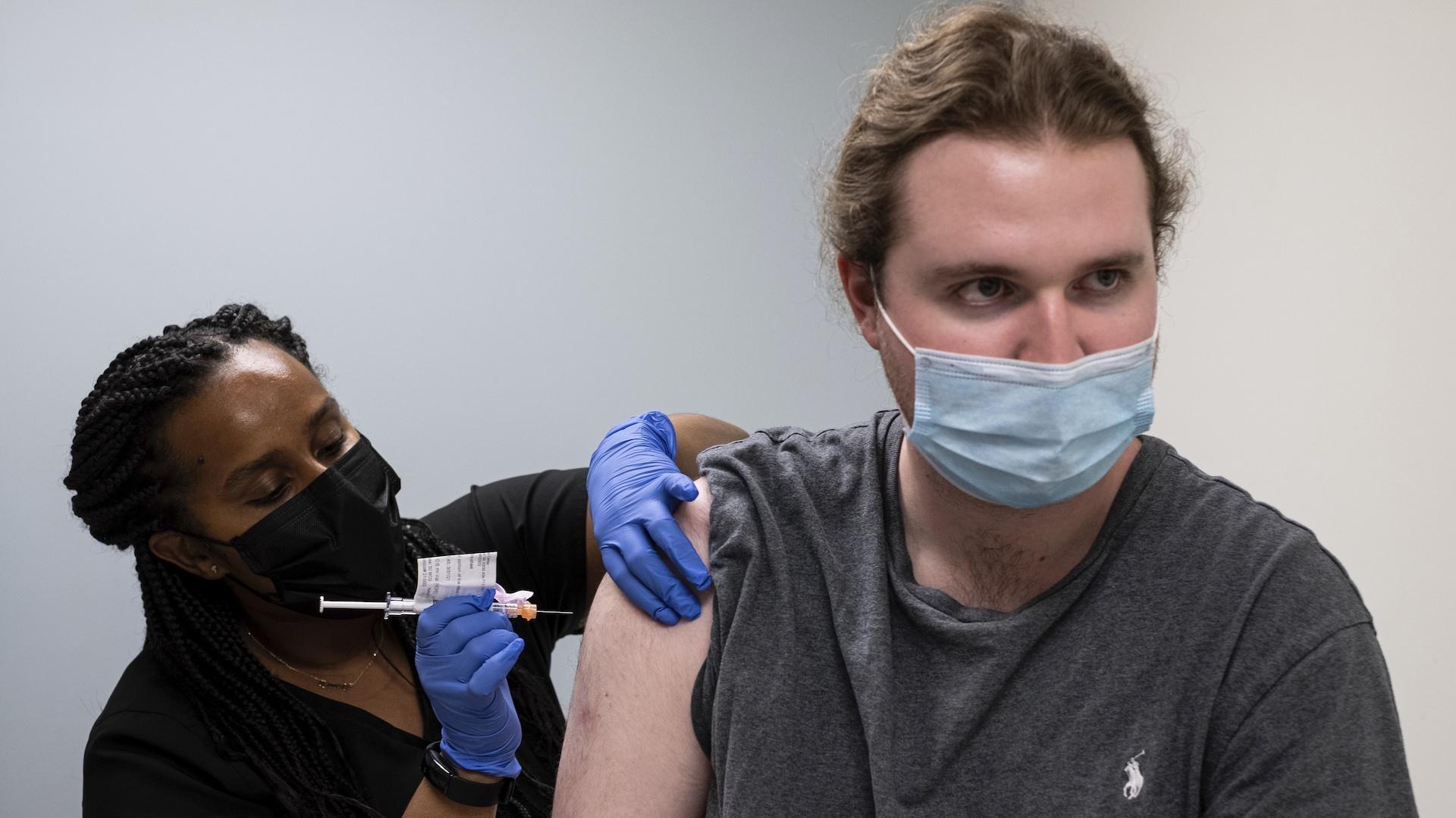 Cole Smith receives a Moderna variant vaccine shot from clinical research nurse Tigisty Girmay at Emory University's Hope Clinic, on Wednesday afternoon, March 31, 2021, in Decatur, Ga. (AP Photo / Ben Gray)