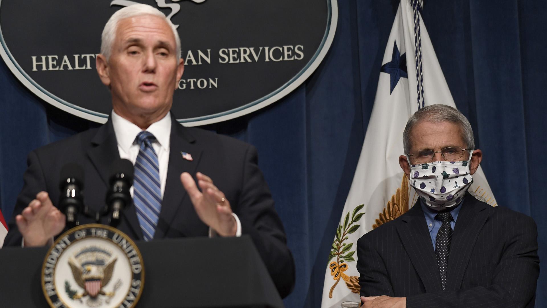 Dr. Anthony Fauci, right, director of the National Institute of Allergy and Infectious Diseases, listens as Vice President Mike Pence speaks during a news conference with the Coronavirus task force at the Department of Health and Human Services in Washington, Friday, June 26, 2020. (AP Photo / Susan Walsh)