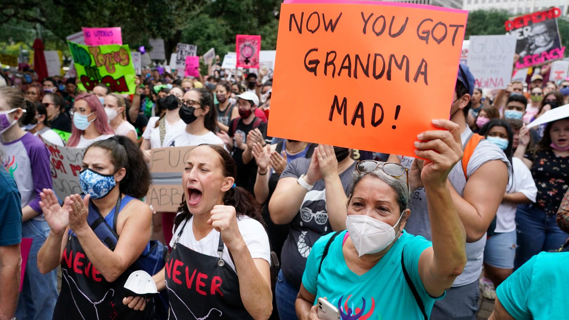 People participating in the Houston Women's March against Texas abortion ban listen to speakers at City Hall Saturday, Oct. 2, 2021, in Houston. (Melissa Phillip / Houston Chronicle via AP)