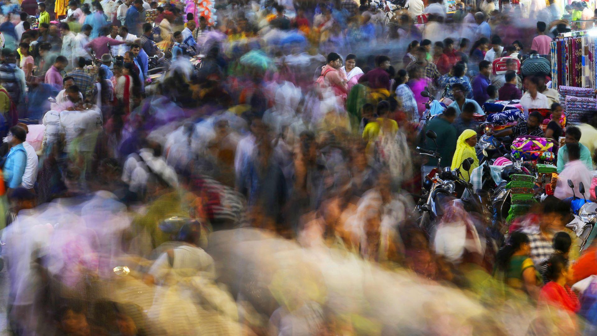 People move through a market in Mumbai, India, Saturday, Nov. 12, 2022. The world's population is projected to hit an estimated 8 billion people on Tuesday, Nov. 15, according to a United Nations projection. (AP Photo/Rajanish Kakade)
