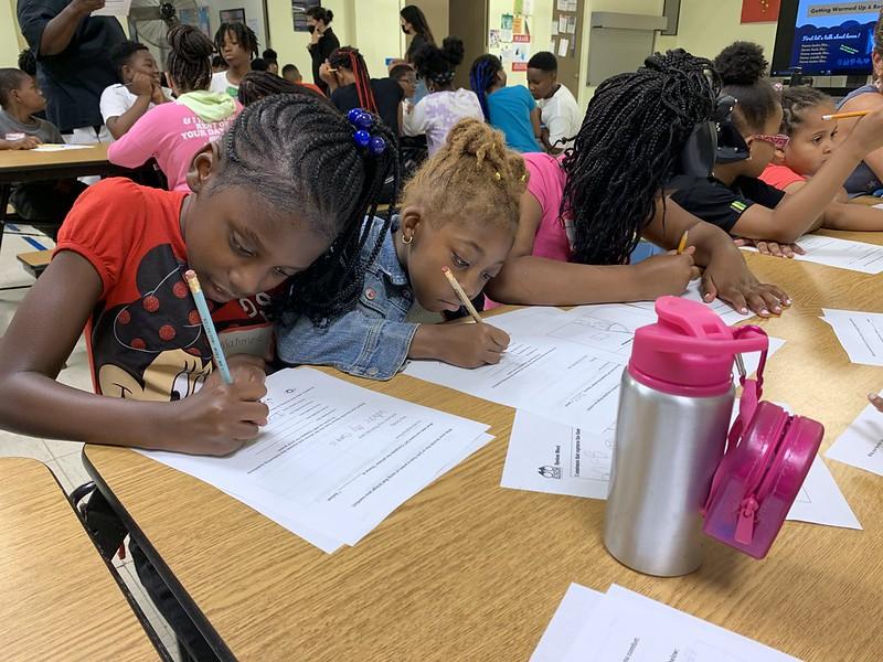 1st-8th grade YMCA summer program students at Cullen Elementary get creative at a Summer 2022 Spoken Word Field Trip workshop in Chicago's Roseland neighborhood. (Courtesy 826CHI)