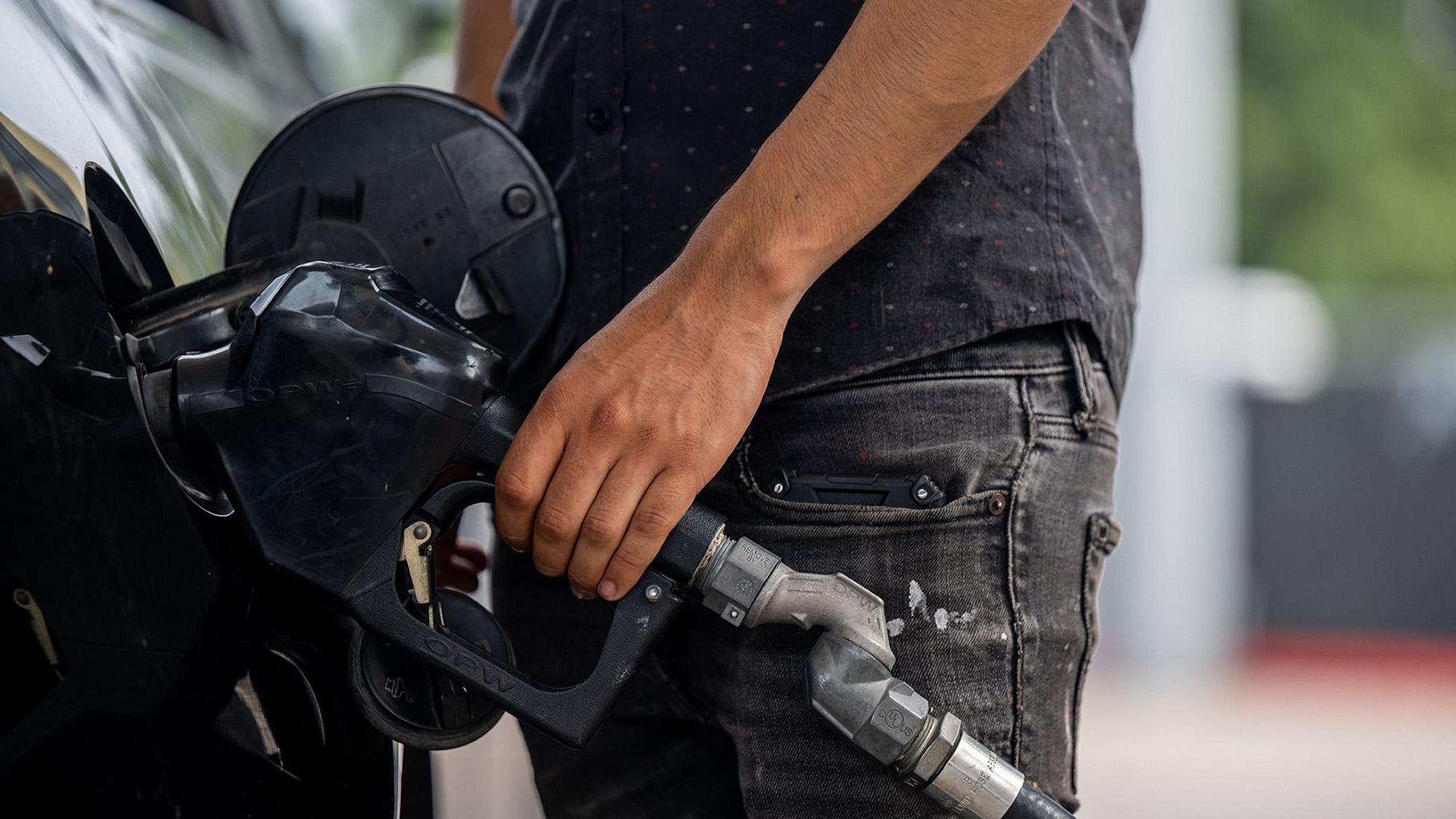 A person pumps gas at a Chevron gas station on May 26 in Austin, Texas. (Brandon Bell / Getty Images via CNN)