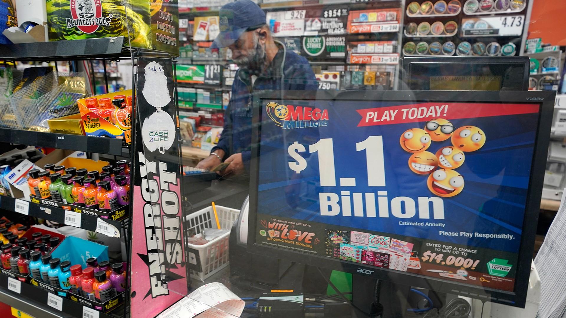 A convenience store in Pittsburgh advertises Tuesday’s rare Mega Millions prize exceeding  billion. (Gene J. Puskar / AP)