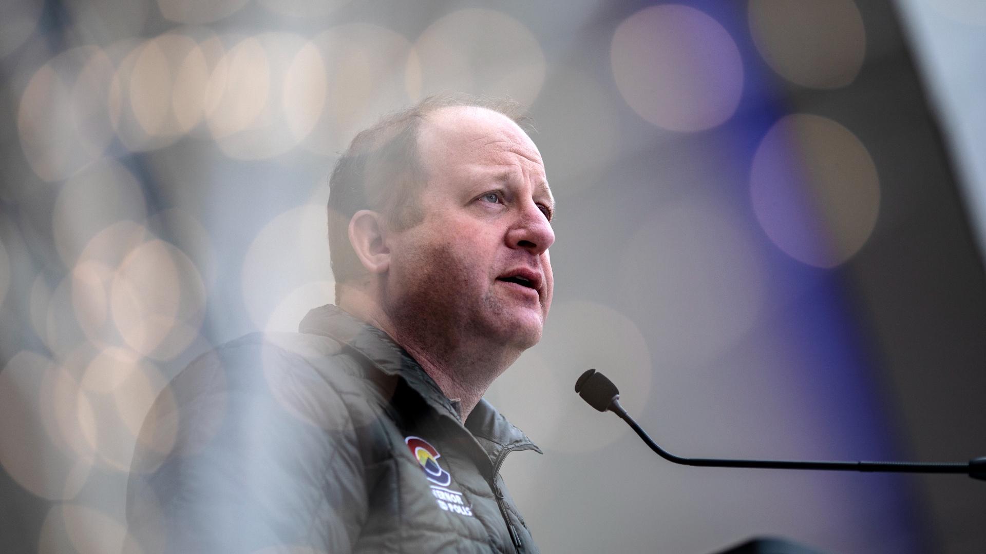 Gov. Jared Polis had earlier announced Colorado would send migrants out of the state to their intended destinations. (Chet Strange / Getty Images / FILE)