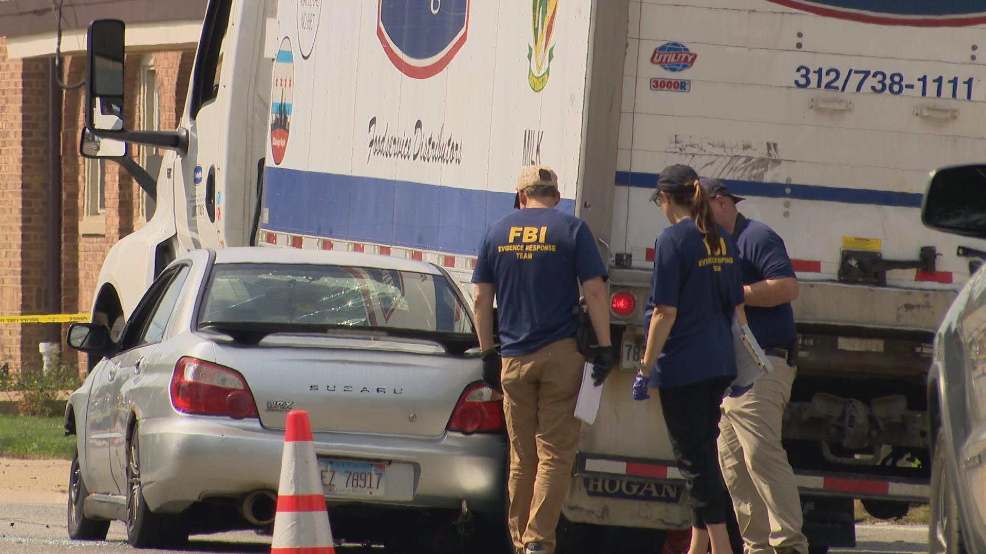 FBI investigators on the scene of a fatal ICE shooting in Franklin Park on Sept. 12, 2025. (WTTW News)