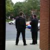 Part of the Mayor's security team wait for him to arrive outside the studio.