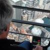 Manning the crane - Ken sits at the controls, 200 feet above the crane's deck
