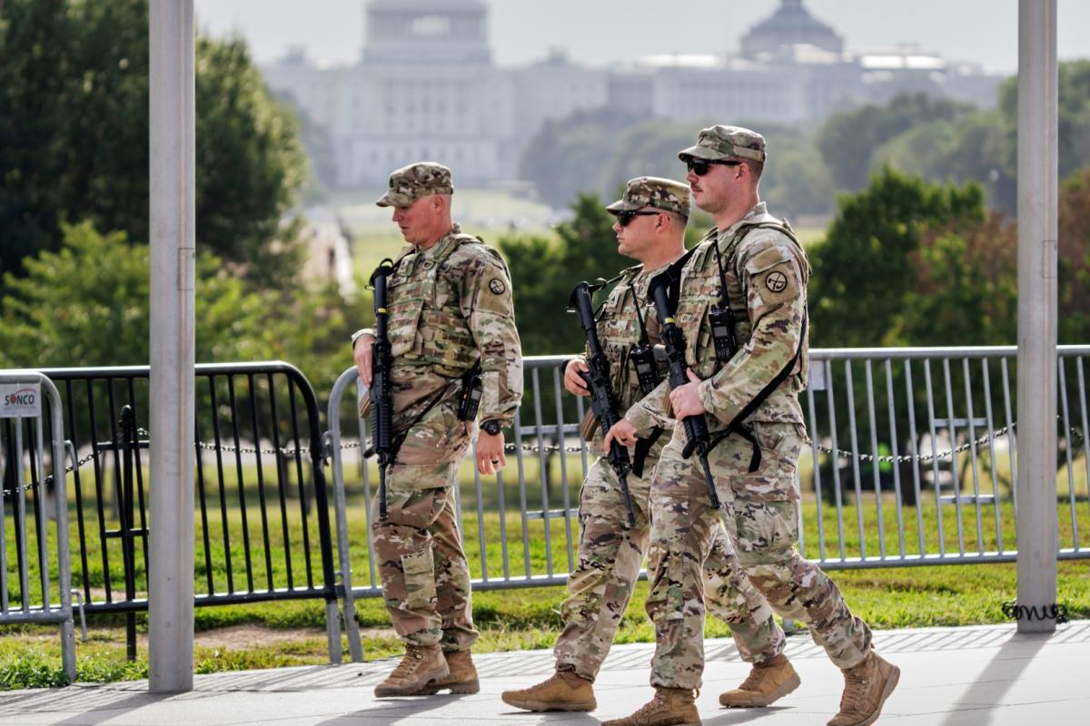 National Guard troops patrol the grounds of the Washington Monument with the Capitol seen in the distance as part of President Donald Trump's order to impose federal law enforcement in the nation's capital, in Washington, Thursday, Aug. 28, 2025. (AP Photo / J. Scott Applewhite)