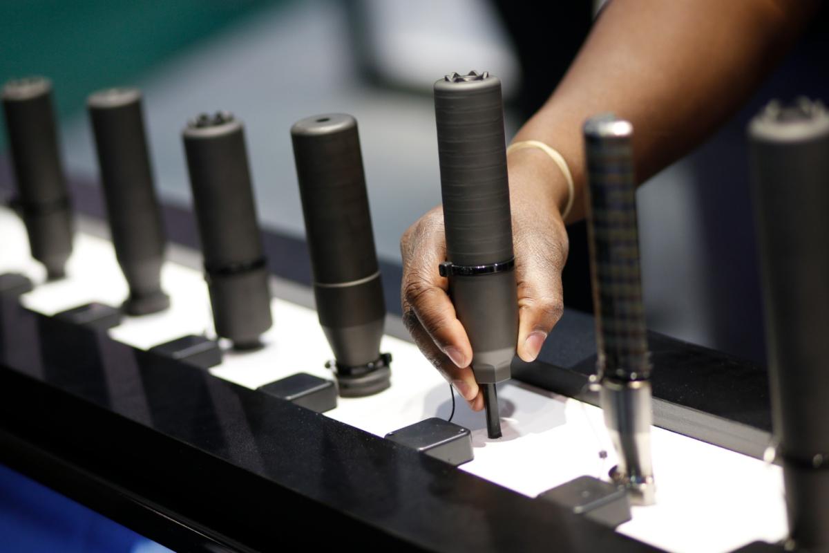 Gun silencers are on display at the Sig Sauer booth at the Shooting, Hunting and Outdoor Trade Show in Las Vegas, Jan. 19, 2016. (AP Photo / John Locher, File)