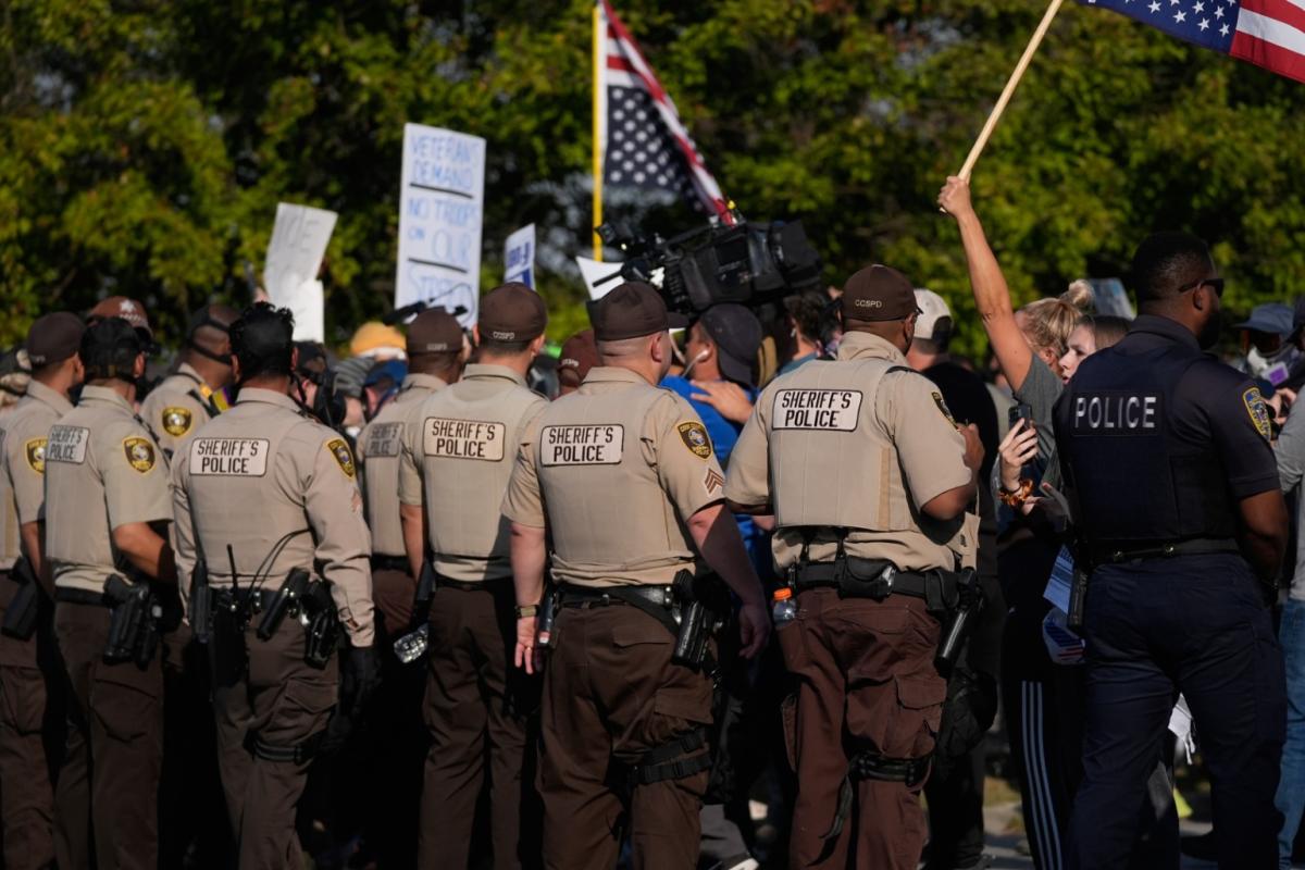 Law enforcement hold back protesters near an Immigration and Customs Enforcement facility in Broadview, Ill., Friday, Oct. 3, 2025. (AP Photo / Erin Hooley)