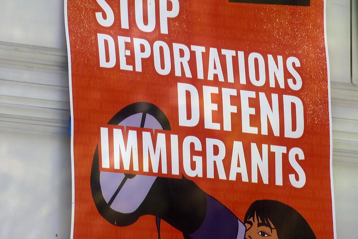 A sign reads "Stop Deportations Defend Immigrants" on Chicago's Northwest Side. (WTTW News)