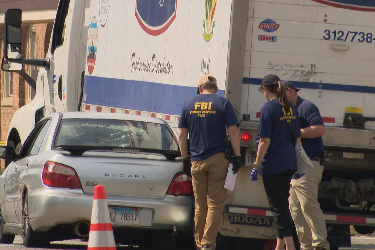 FBI investigators on the scene of a fatal ICE shooting in Franklin Park on Sept. 12, 2025. (WTTW News)