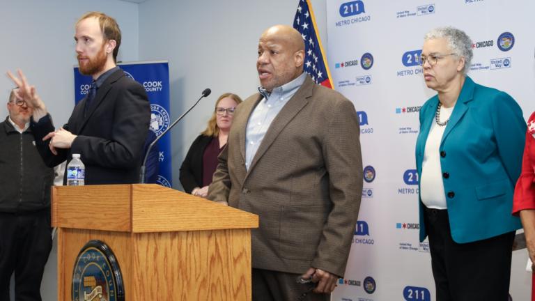 Brian Lewis, center, speaks about his experience as a resource navigator with 211 Metro Chicago, alongside Cook County Board President Toni Preckwinkle, right, during a news conference celebrating the second anniversary of the helpline on Feb. 11, 2025. (Courtesy of United Way of Metro Chicago)