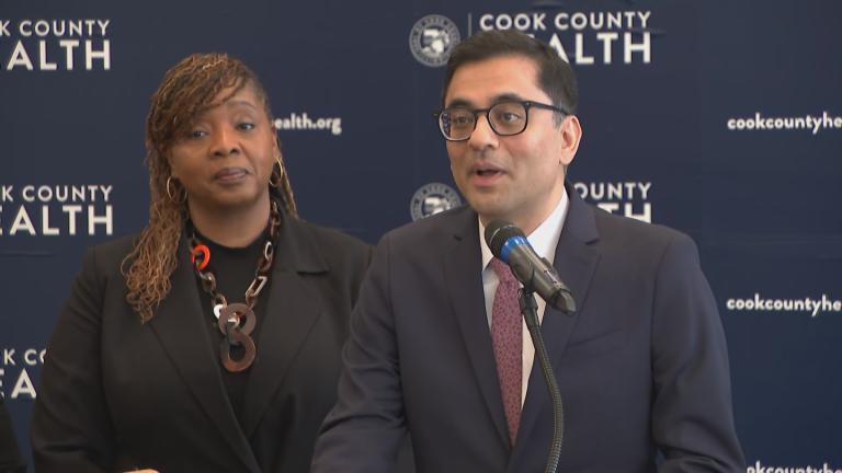 Interim Chief Operating Officer of the Cook County Department of Public Health Dr. Kiran Joshi, right, speaks during a Feb. 14, 2025, news conference about safe sex and sexually transmitted infections, alongside Cook County Commissioner Kisha McCaskill (5th District). (WTTW News)