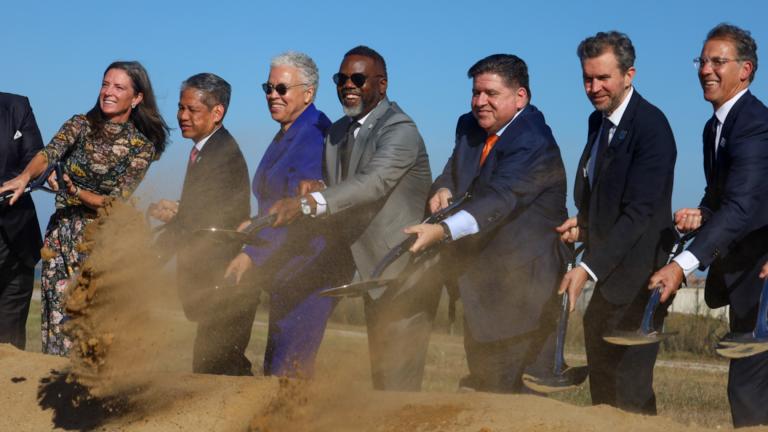 Elected officials and businesspeople throw a ceremonial amount of dirt at the groundbreaking event for the Illinois Quantum and Microelectronics Park on Sept. 30, 2025. Pictured from left to right: Blue Owl Capital Managing Director Colleen Collins, Commonwealth Edison CEO Gil Quinones, Cook County Board President Toni Preckwinkle, Chicago Mayor Brandon Johnson, Gov. JB Pritzker and PsiQuantum CEO Jeremy O’Brien. (Capitol News Illinois)