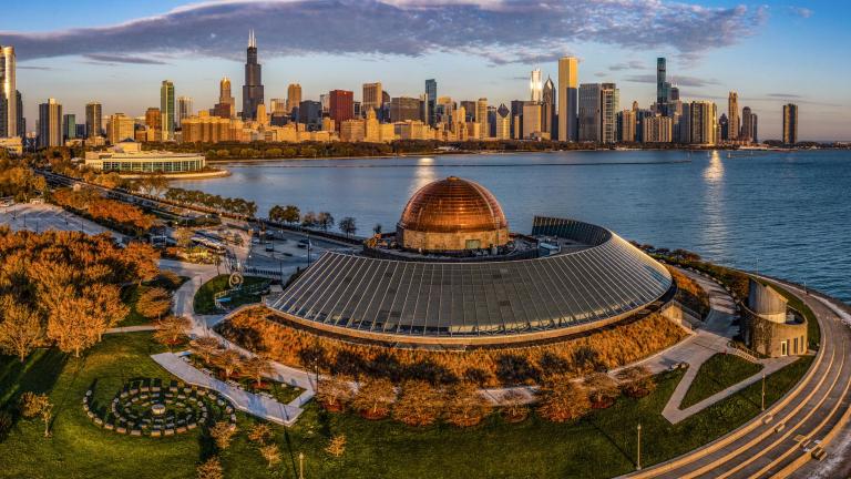 An aerial view of the Adler Planetarium against the Chicago skyline. (Vito Palmisano / iStock)