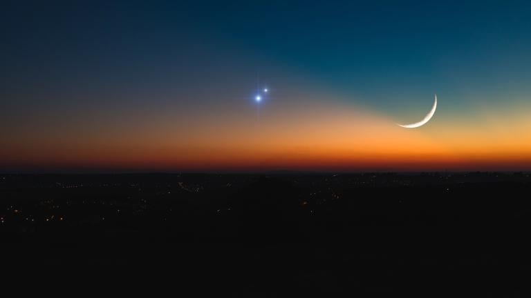 The Jupiter-Saturn "great conjunction," seen in December 2020. During a conjunction, distant objects appear to be quite close to each other. (m-gucci / iStock)