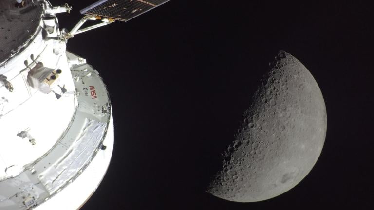 The moon appears next to the Orion spacecraft. (Courtesy of NASA)