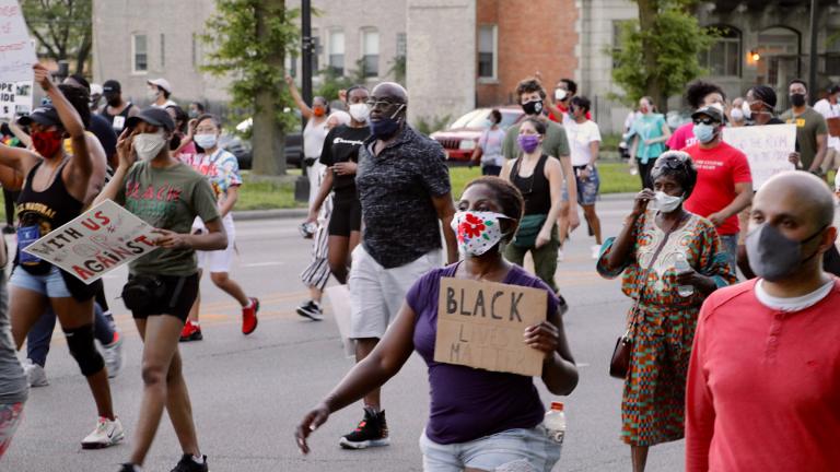 Protesters march along Martin Luther King Jr. Drive in Bronzeville on Tuesday, June 2, 2020, just over a week after the death of George Floyd at the hands of Minneapolis police. The peaceful demonstration was organized by local faith leaders. (Evan Garcia / WTTW News)