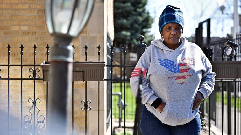 Mary Buchanan, 68, stands outside her home in West Garfield Park on March 21, 2024, examining the recent construction to her front lawn. She paid $12,000 to install a check valve to prevent waste water from flowing into her home the next time her neighborhood floods. Her basement was significantly damaged in July 2023 after a major storm. (Victor Hilitski / Illinois Answers Project)